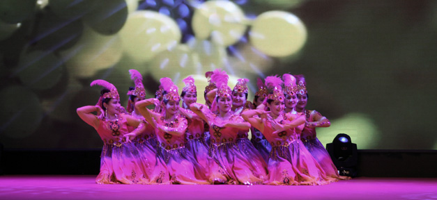 Beautiful Folk dance and projected images, Gaochang District vocational and training center (Turpan).